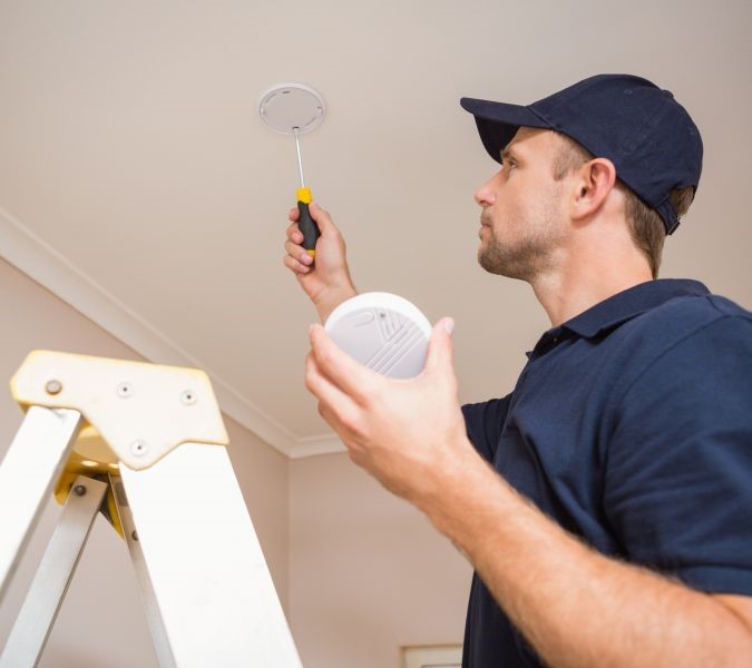 Smoke Detector being installed by HSI